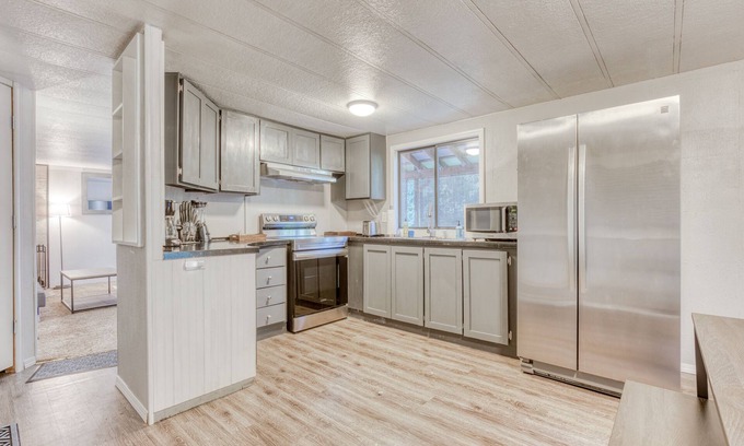 Sandy House | Serene home with large outdoor deck, beautiful forest views, firepit & gas grill