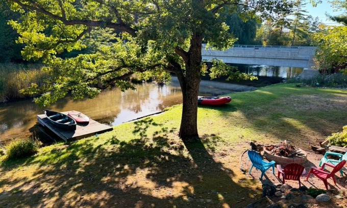 Rapid City House | Serene, Spacious Riverfront Home close to Torch Lake with lots of Entertainment