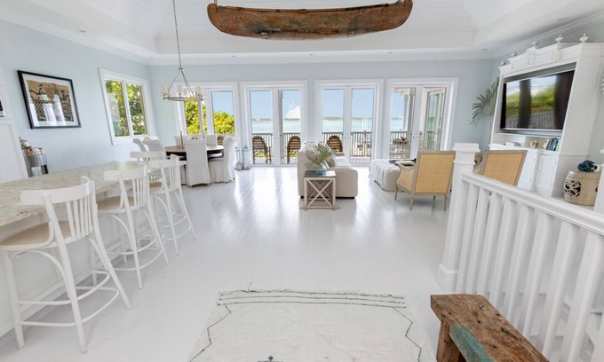 Dunmore Town House | Serene waterfront house w pool, dock & beautiful sunsets - 5 min walk to beach.
