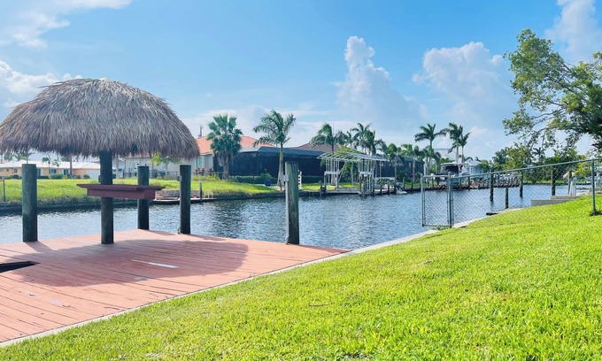 Eight Lakes House | Short Distance From Tarpon Point Marina! Gulf Access, Heated Pool, Dock & Tiki!