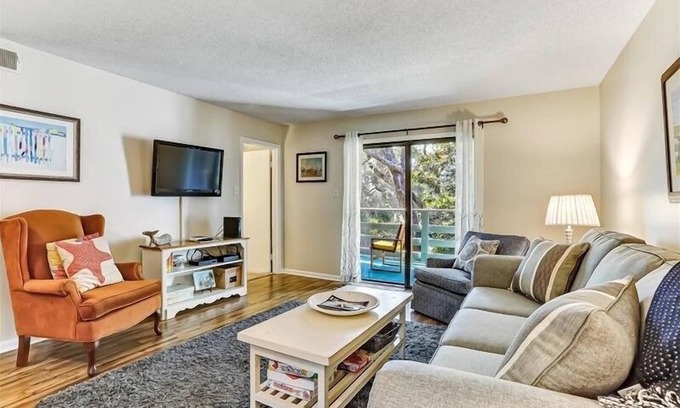 Fernandina Beach Condo | Short walk to beach. Open kitchen, dining room and living room spills out onto the private balcony