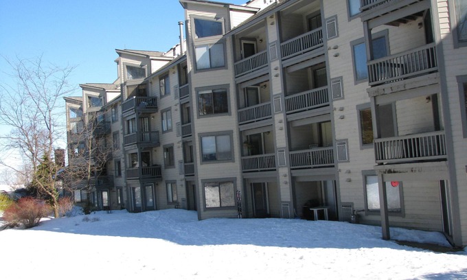 White Condo | Ski- In, Ski- Out, Ground Floor, Wi-Fi , lounge with hot tub, sauna & fireplace
