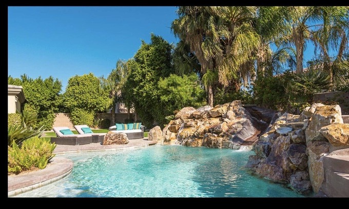 Orchards House | Sleek 4121 sq ft estate with a heated waterfall pool with a slide