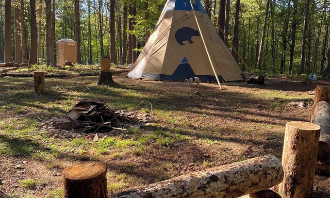 Ironto RV Rental | Sleep under the trees in a Native American Tipi - off-grid glamping experience!