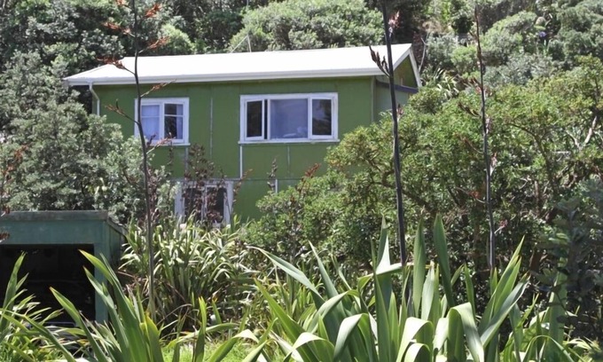 Baylys Beach Cabin | Small Traditional Family Bach within walking distance to beach.