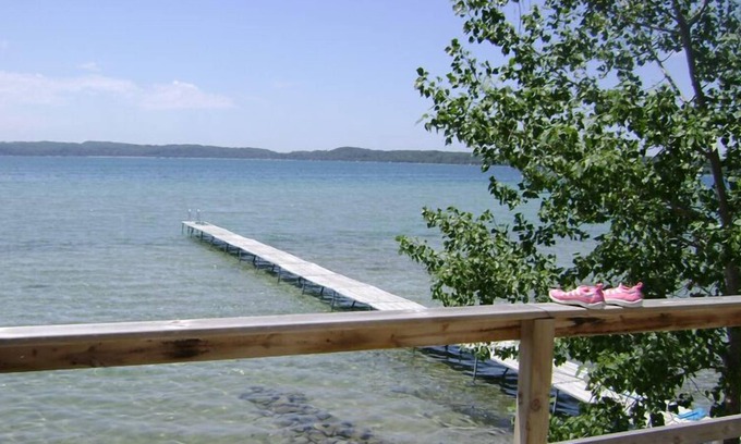 Lake Township Cottage | Sought-After West-End, Designer Cottage Right on Water