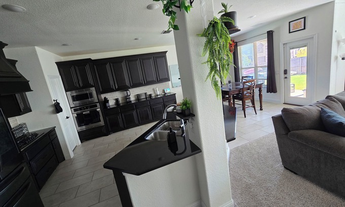 Argyle House | Spacious 4-bedroom Smart Home in Argyle with AC/Heat, small gym, and TVs galore