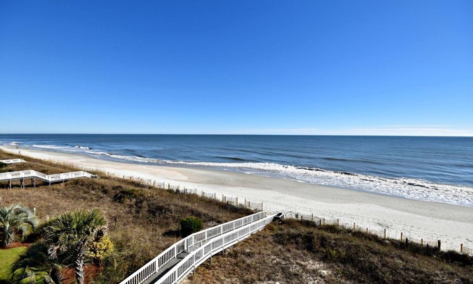 Litchfield by the Sea House | Spacious 7 BR, 7.5 BA oceanfront house with screened porch and hammock = RELAX