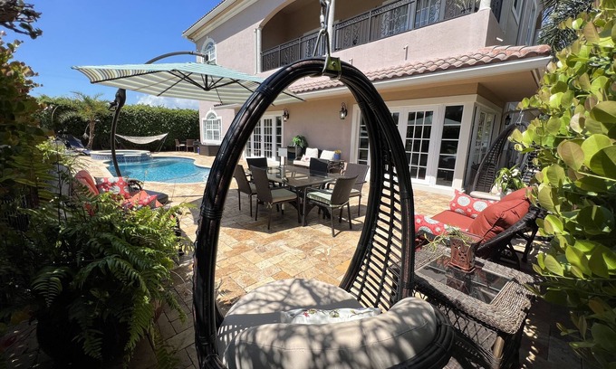 Garden Isles House | Spacious, beautiful 4 bedroom house with heated pool 10 min from Beach.