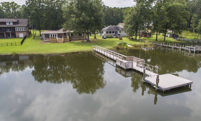 Prosperity House | Spacious grounds and home with large deck and dock in quiet cove.