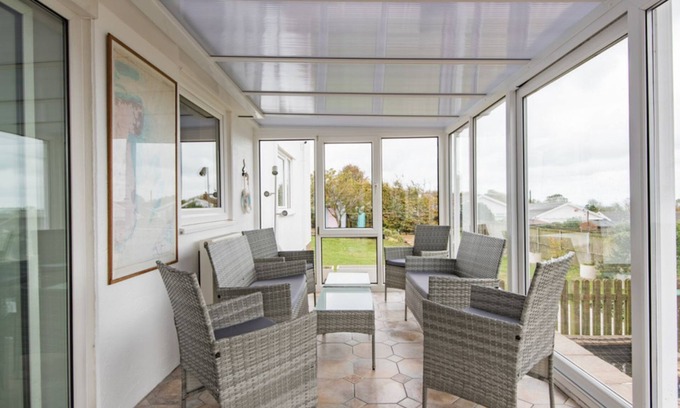Martin House | Spacious holiday home with panoramic views of the sea and golf course