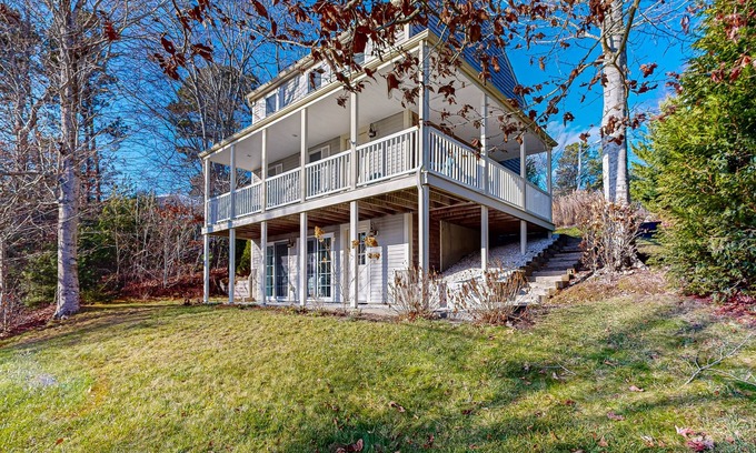 Mashpee House | Spacious home close to Peters Pond Beach with porch, AC, W/D, & water view