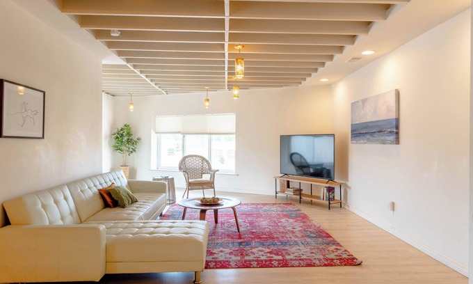 Roseville Apartment | Spacious modern loft with a city view.
