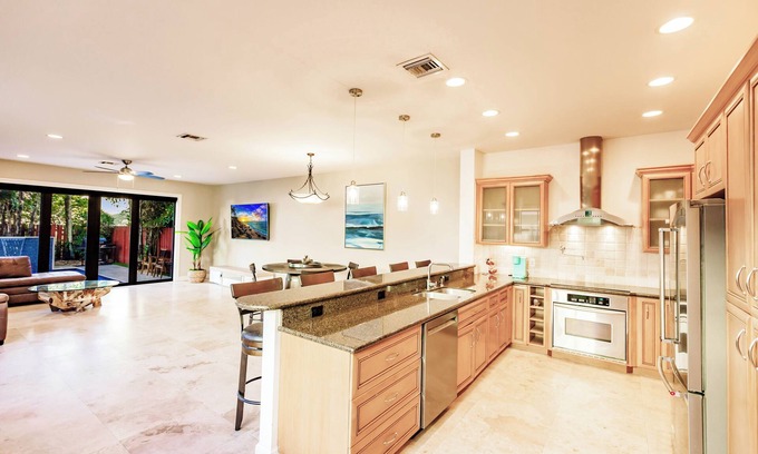 Sailboat Bend House | Spacious townhouse in downtown with rooftop terrace, heated pool, and king bed