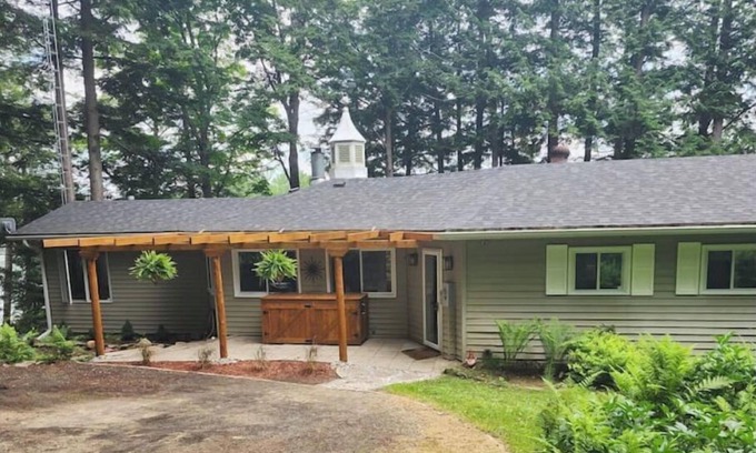 Haliburton House | Spacious, waterfront home surrounded by trees with large dock & games room.