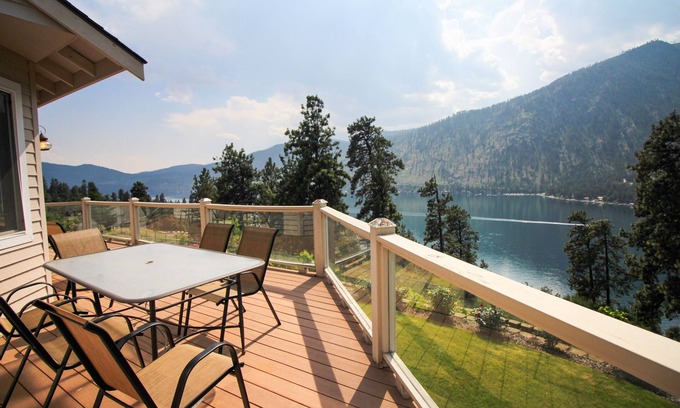 Helios Hills House | Spacious & Welcoming Home with Lake View, Private Hot Tub, & Wraparound Deck
