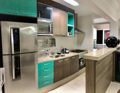 Indaia Apartment | Spazio Felicita, Indaia, Bertioga, apartamento pé na areia