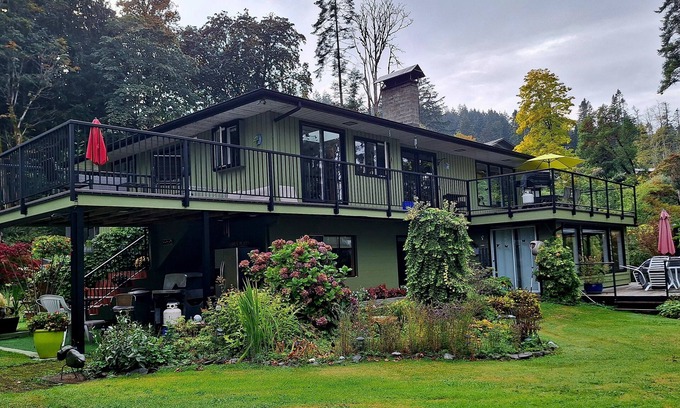 Heriot Bay House | Spectacular beach front property with stunning view of coastal mountains. n