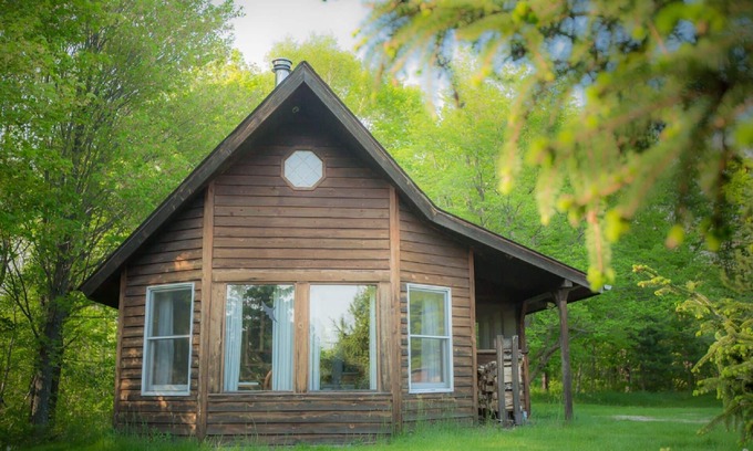 Finlayson Cabin | Spiral Staircase Leads To The Lofted Bedroom With Wall To Wall Knotty Pine.