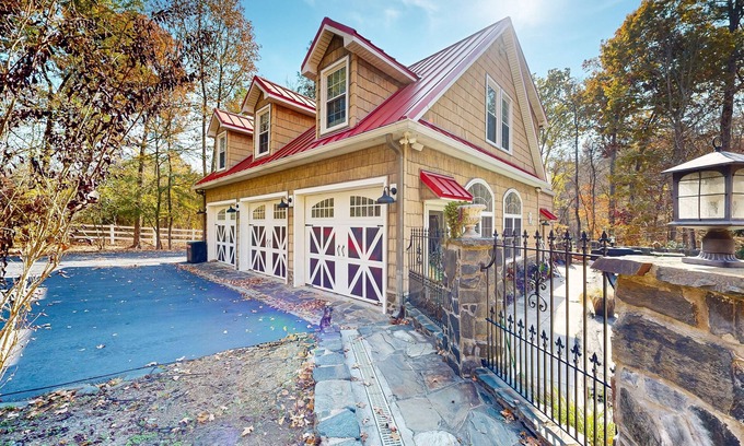 Chester County House | Sprawling property with a pool, hot tub, fireplaces, grill, retro bedroom, & AC