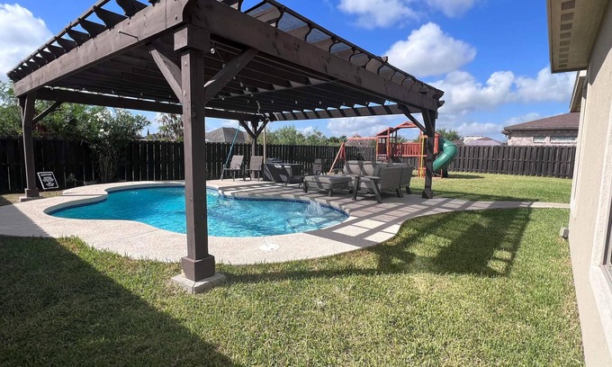 Brownsville House | Stately retreat with backyard oasis - pool, inviting patio - plus modern kitchen