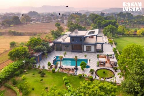 Faridabad Villa | StayVista's Hampton Acres - Outdoor Pool, Vast Lawn & Terrace