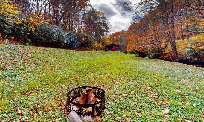 Frank House | Streamside cottage on +2 acres with large deck, firepit, fireplace, & W/D