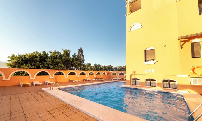 Roquetas de Mar Apartment | Studio Apartment 'Estudio En La Playa' with Mountain View, Shared Pool and Wi-Fi