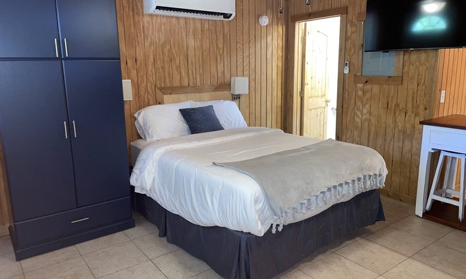 Porum Cabin | Studio cabin #2 with lake view, boat dock access, outdoor seating, and firepit.