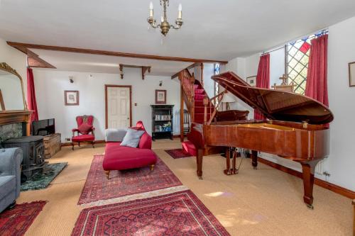 Wadeford House | Stunning baptist chapel with concert piano, pets welcome