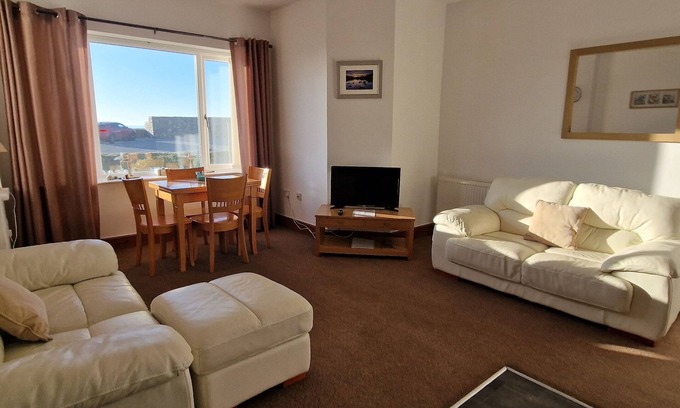 Dinas Apartment | Stunning Beach Front Apartment- Sands - Wendon - Ground Floor