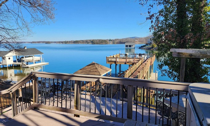 Penhook House | Stunning lake front with private dock and pontoon boat available for rent