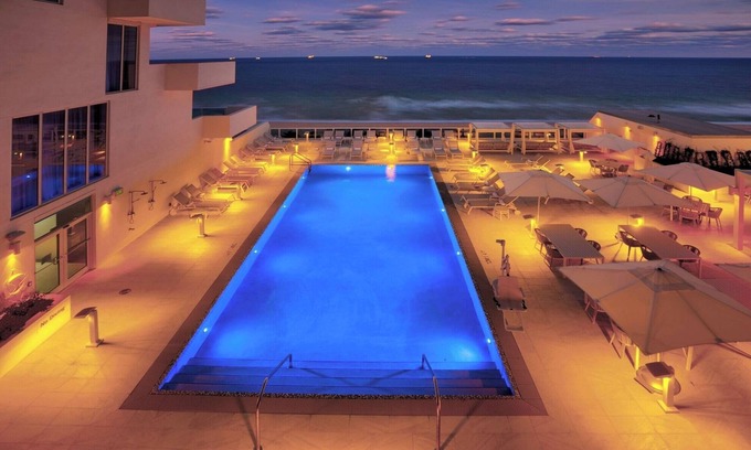 Central Beach Hotel | Stunning Marina Views, Private Balcony, inviting Pool, steps from Riverwalk