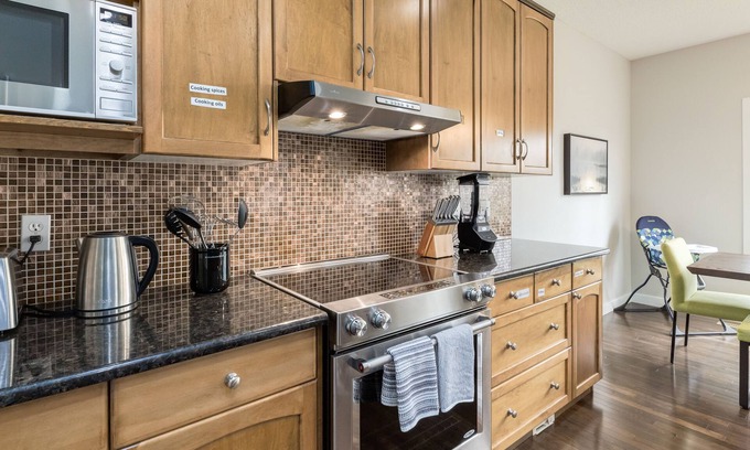 Southwest Calgary House | Stunning Oasis in Upscale Aspen Woods, Close to COP & Downtown