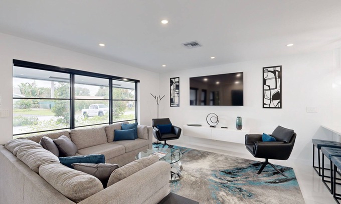 Coral Ridge Isles House | Stunning single level home with, heated pool, kitchen, & fully equipped BBQ area
