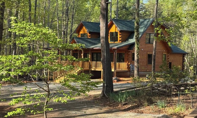 Union Hall Cabin | Stunning SML lakefront cabin: luxurious finishes, spacious rooms, wraparound deck, easy dock access. Family-friendly with toys, media room, serene views!