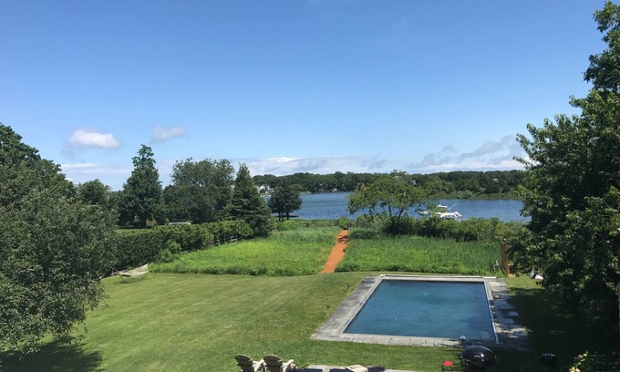Sag Harbor House | Stunning Waterfront 4 Bedroom Home with Pool, a Dock, an Acre of Land & a Boat