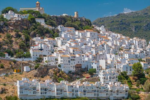 Casares House | Stylish 3 bed house 2 bathrooms, with patio, roof terrace and communal pool 5 minutes away from the beautiful Spanish white village of Casares Pueblo and only 20 mins from the sea
