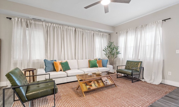 Near Northside Apartment | Stylish 3-Story Home Sleeps 14 Near Monon Trl WiFi, AC + Private Hot Tub