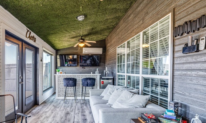 San Angelo House | Stylish corner home with cozy interiors, a private bar, and inviting charm