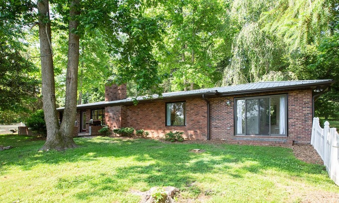 Hendersonville Cottage | Stylish cottage bordering one of the farm's sweeping pastures.