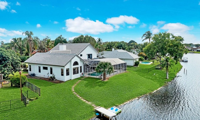 Wellington Villa | Stylish Lake Luxe Equine, on waterfront w screened-in pool - Lake Views! Hosted By Relaxtay