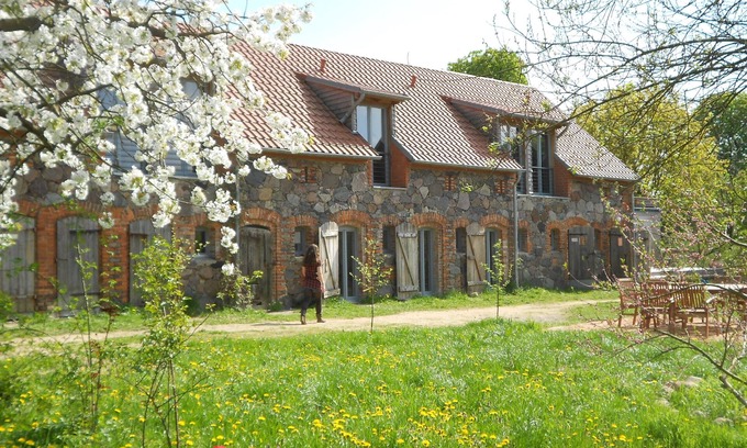 Hirschfelde House | Stylishly furnished fieldstone barn with dining room and terrace by the village pond