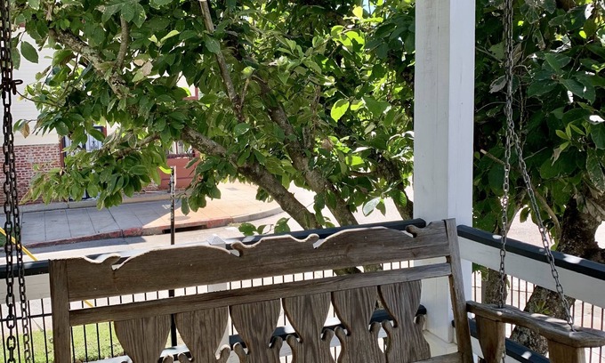 Spanish Town Historic District House | Suite with sitting area and ensuite bath with Clawfoot tub