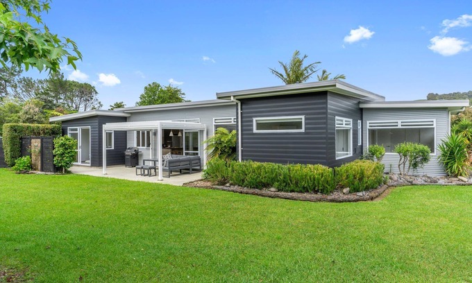 Mangawhai House | Sun Central - Modern, sunny holiday home in tranquil garden setting