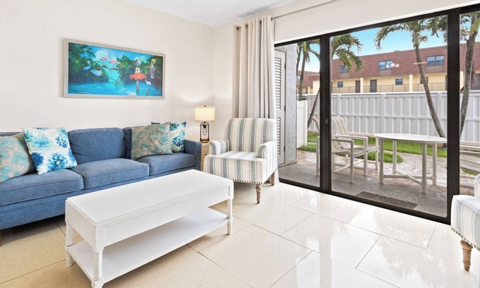 Port Canaveral Condo | Sun-Soaked Ground Floor Corner Condo – W/BBQ Grills, Heated Pool & Steps to the Pier! ☀️