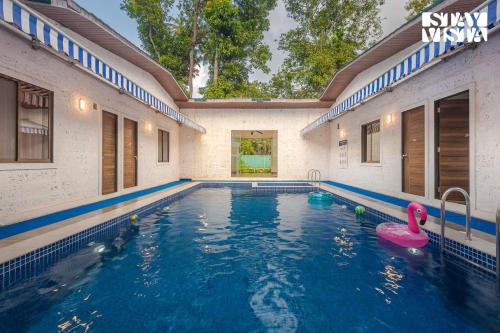 Nagaon Villa | Sundream Palms by VEO - Part of StayVista with Pool, Lawn, BBQ