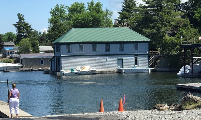 Fishers Landing Cottage | Sunny cottage built over the water on the St. Lawrence River