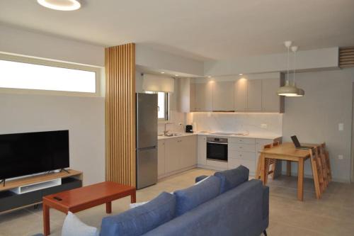 Gerani Apartment | Sunny flat among olive trees, next to the beach