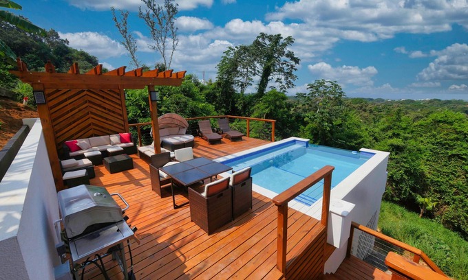 Sandy Bay House | Sunset and Ocean views at Sandy Feet Retreat with private infinity pool.